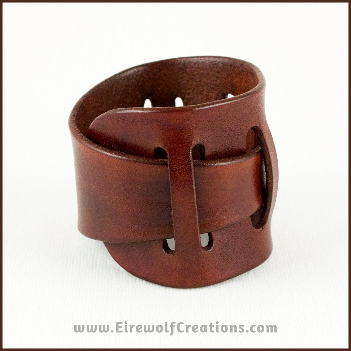 Handmade Leather Adjustable Claspless Slotted Wrist Cuff Bracelet, 2 inches wide, dyed brown. By Erin Metcalf of Eirewolf Creations.