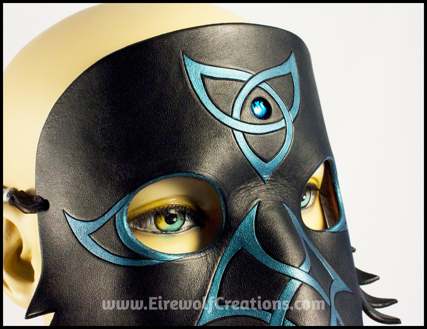 Celtic Raven mask with blue paua shell and iridescent teal Celtic knots, handmade leather masquerade mask, crow black bird, elegant Mardi Gras or Halloween costume