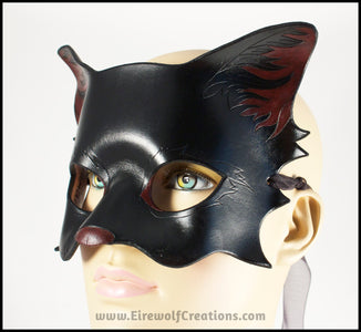 A handmade black cat leather masquerade mask with dark red nose and inner ears. By Erin Metcalf of Eirewolf Creations.