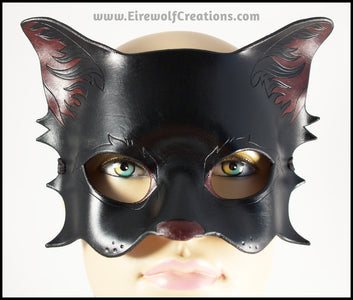 A handmade black cat leather masquerade mask with dark red nose and inner ears. By Erin Metcalf of Eirewolf Creations.