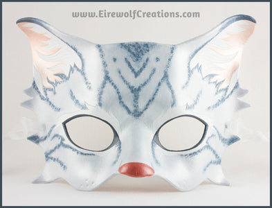 A handmade leather silver-gray tabby cat mask for a masquerade costume, with handpainted stripes, a dark pink nose and light pink inner ears. By Erin Metcalf of Eirewolf Creations.