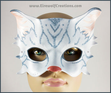 A handmade leather silver-gray tabby cat mask for a masquerade costume, with handpainted stripes, a dark pink nose and light pink inner ears. By Erin Metcalf of Eirewolf Creations.