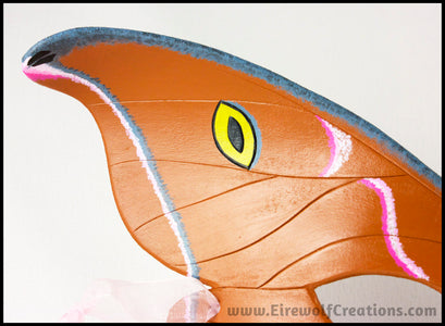 Detail of a handmade leather moth mask for a masquerade costume, handpainted to resemble the Antheraea Polyphemus moth. By Erin Metcalf of Eirewolf Creations.